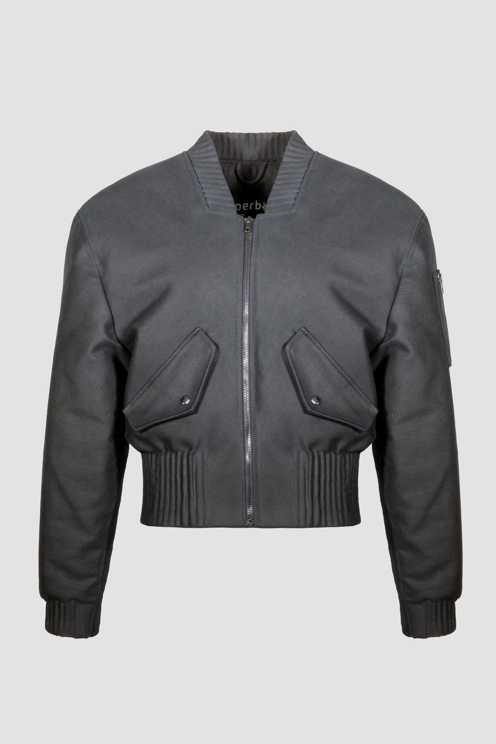 A black bomber jacket "Alles-Von-Hier" (Everything from Here) by Esther Perbandt, with a ribbed knit collar, cuffs, and hem, featuring a front zipper and two angled flap pockets, shown against a light studio background.
